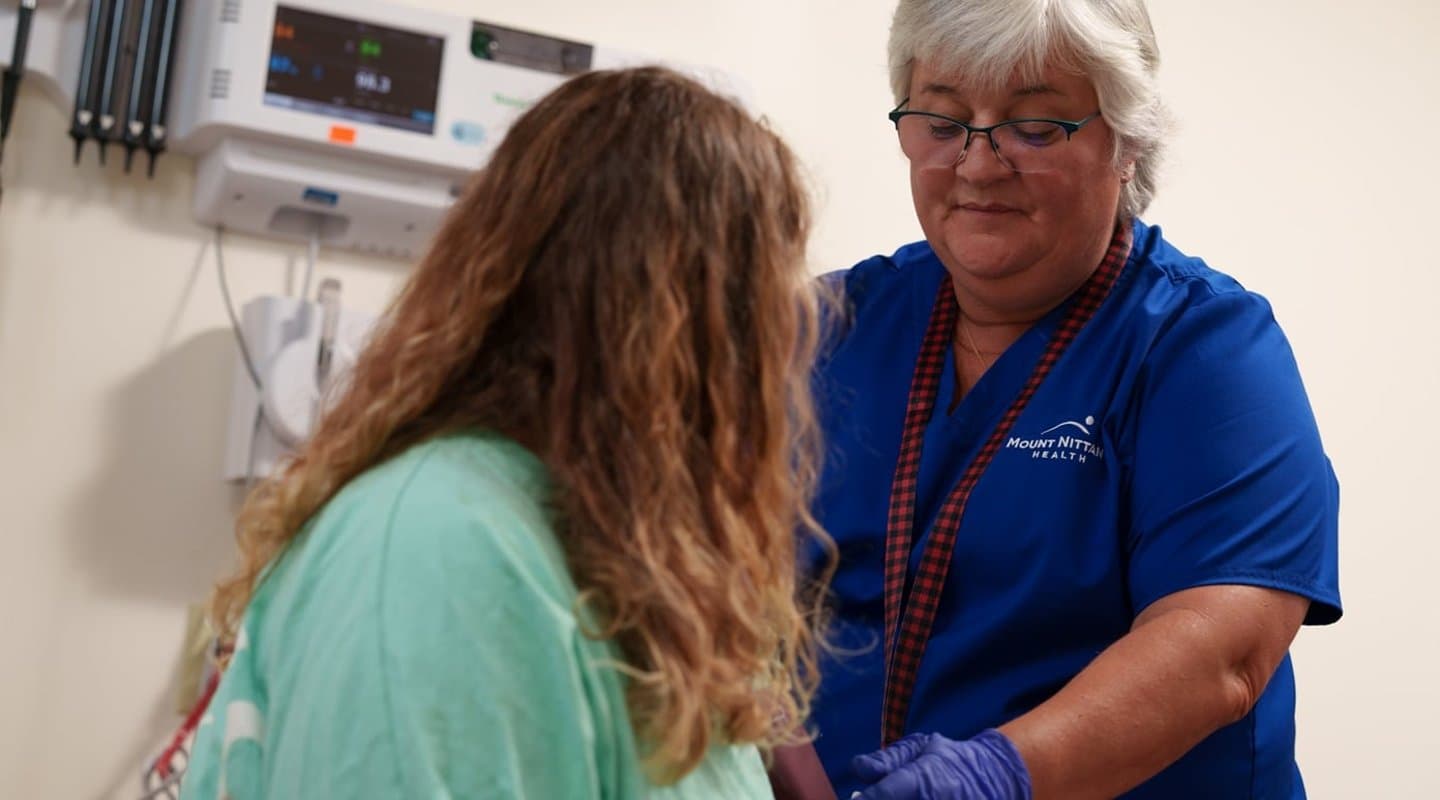 LPN working with a patient.