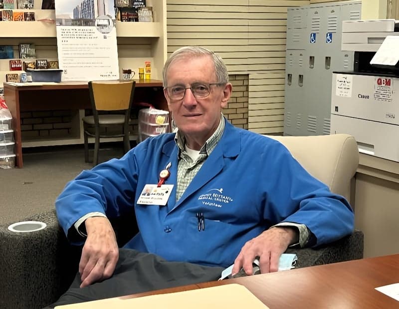 A volunteer in an office
