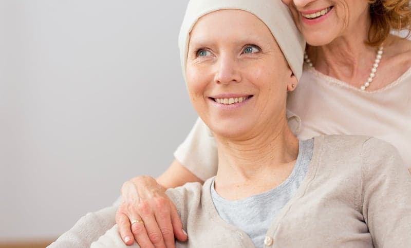 A breast cancer patient sits with her mother.