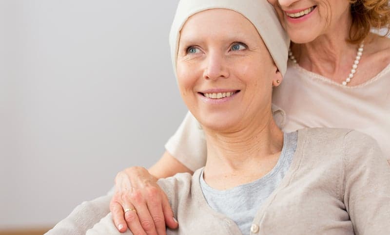 A breast cancer patient sits with her mother.