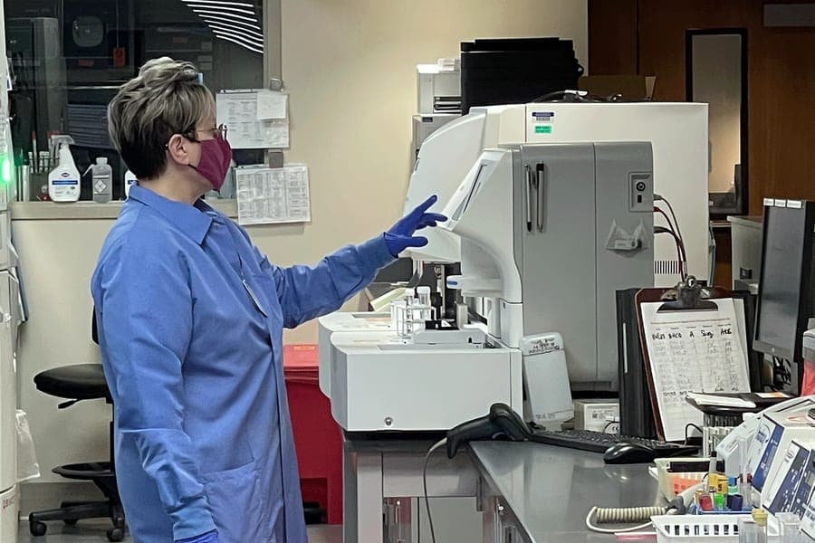 Women looks at lab equiptment