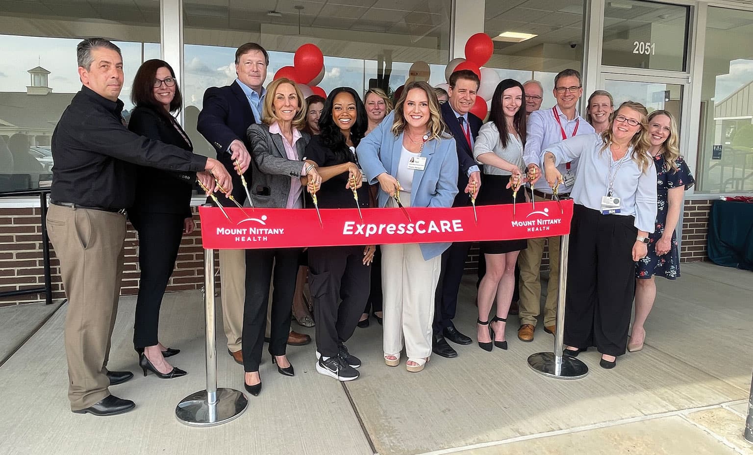 Mount Nittany Health leaders gather to cut the ribbon at Mount Nittany Health ExpressCARE