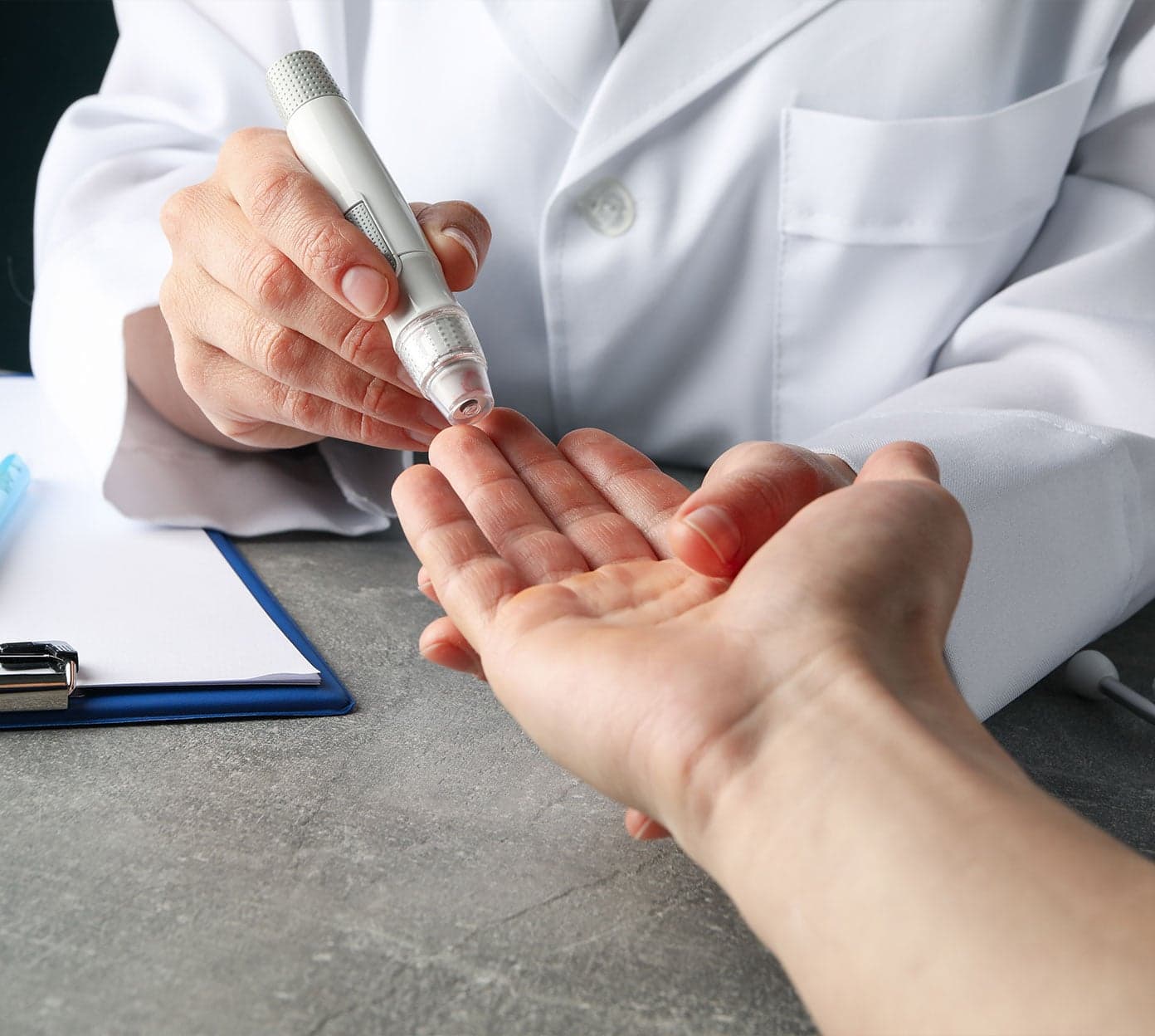 Endocrinology services at Mount Nittany Health with a team of specialists consulting with a patient.