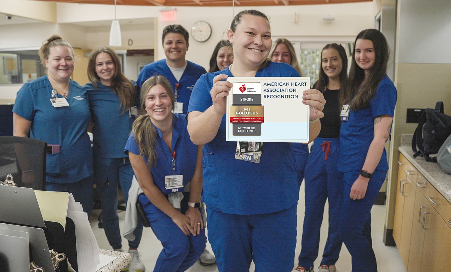 Stroke team poses with the certificate in the Emergency Department