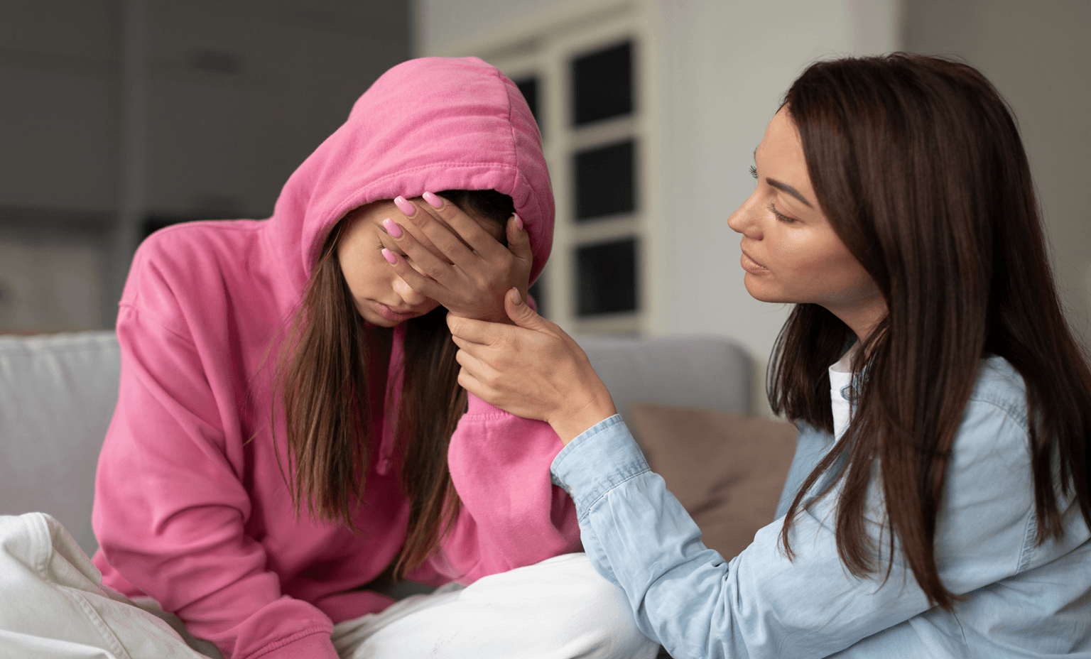 mother supporting teenage girl