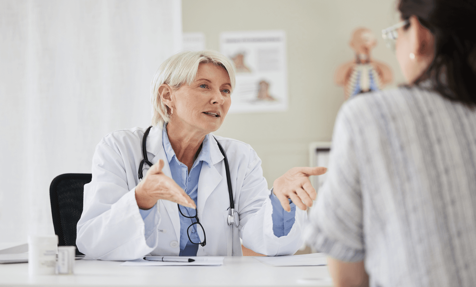 Doctor speaking with patient in office