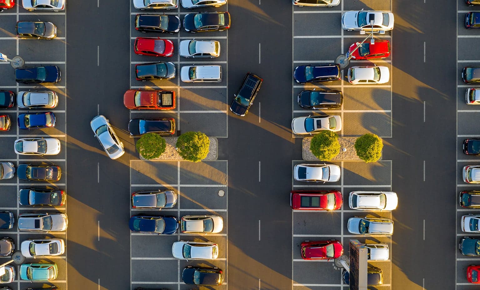Aerial view of a parking lot full of cars