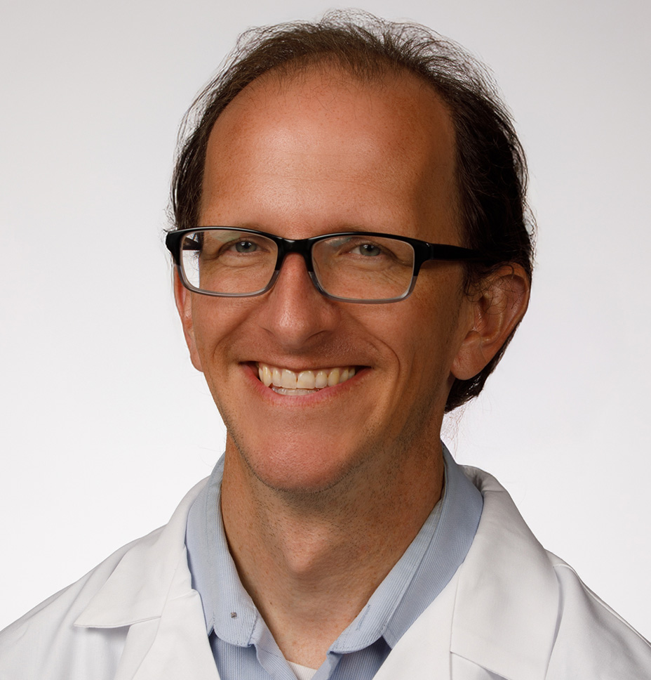 Daniel Pitts, MD smiles for a professional headshot photo