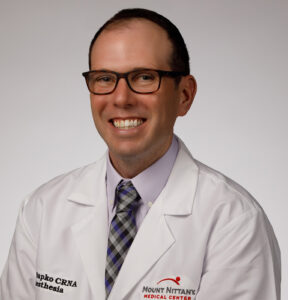 Mark Sapko wears glasses and smiles