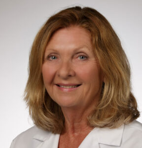 Dr. Melanie Chaputa Cherry, OBGYN smiles at the camera