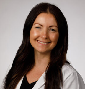 Natalie Tussey smiles in a professional headshot photo