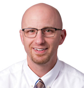 A headshot of orthopedic and sports medicine physician assistant, Nathaniel L. Pozniak.