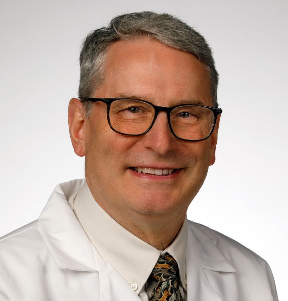 Stephen Tingley, MD smiles in a professional headshot photo while wearing his white coat