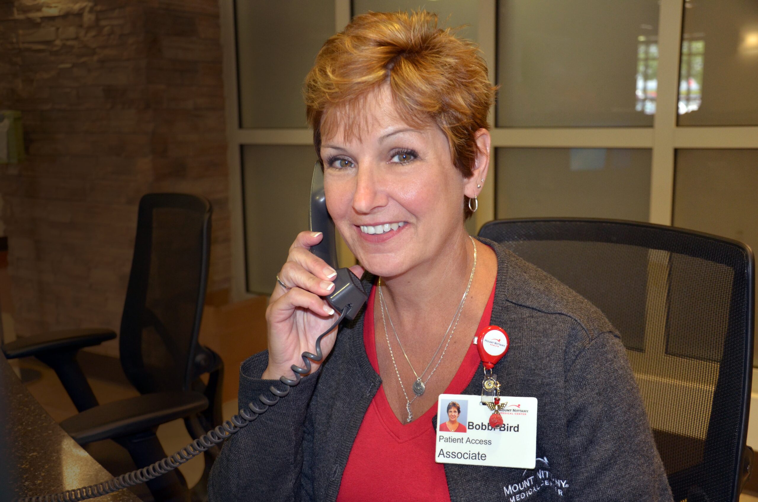 Woman smiles while answering a phone call