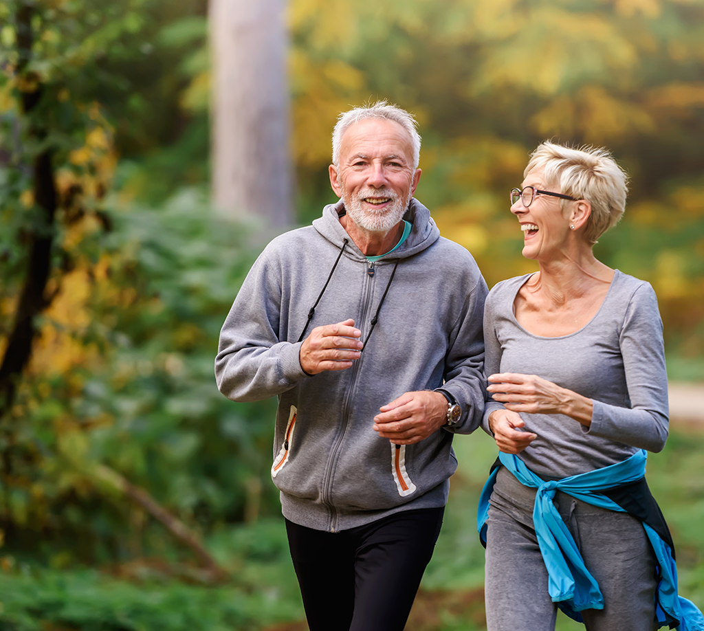 Couple walks outdoors after being treated by orthopedics