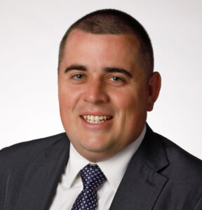 Kevin Gerrity, DO smiles for a professional headshot photo