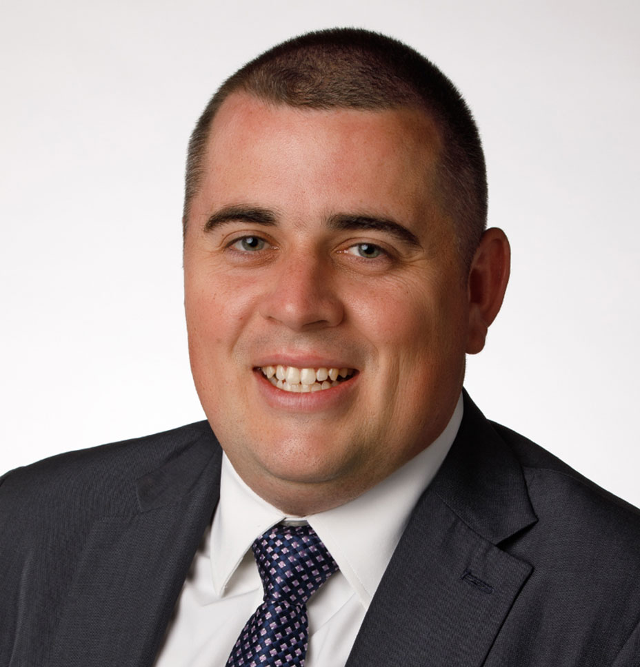 Kevin Gerrity, DO smiles for a professional headshot photo