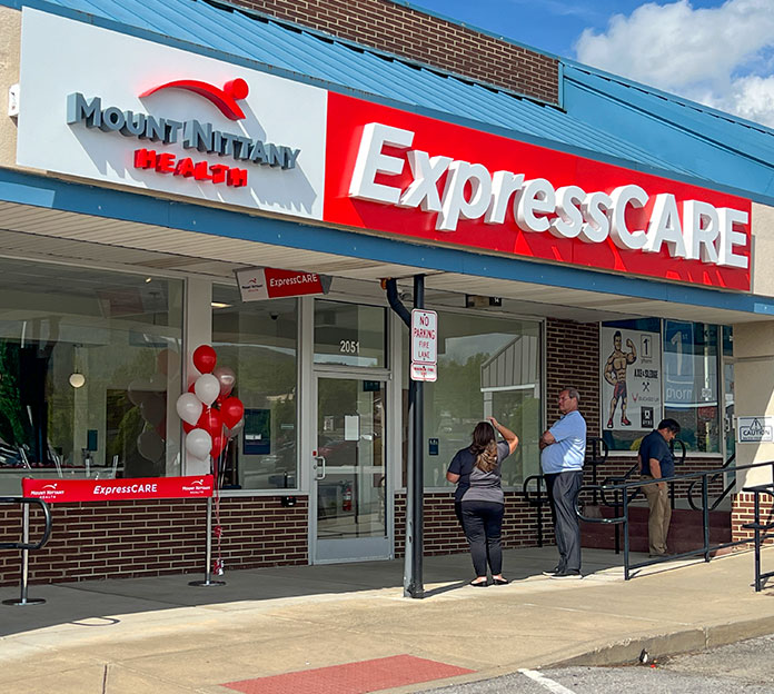 Front entrance to Mount Nittany Health ExpressCARE with people standing outside