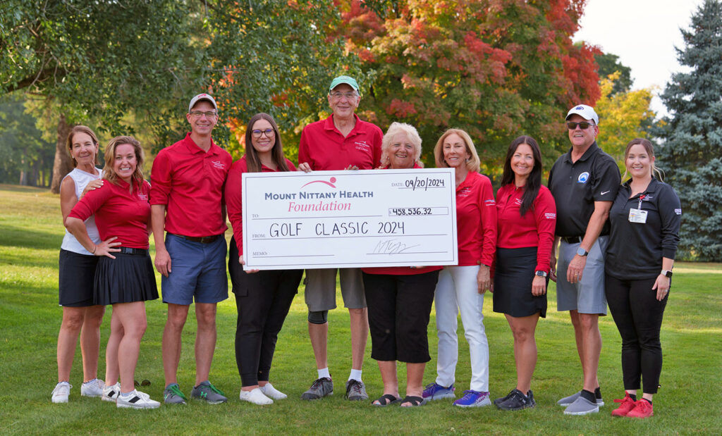 Mount Nittany Health Foundation Golf Classic Committee poses with check