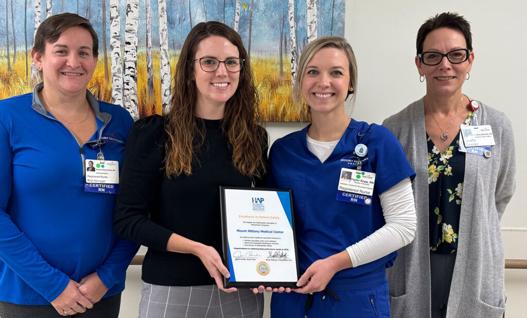 Patient Safety and Quality staff pose with the 2024 HAP award