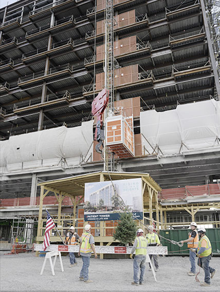 The last steel beam is raised and placed at the new patient tower at Mount Nittany Medical Center