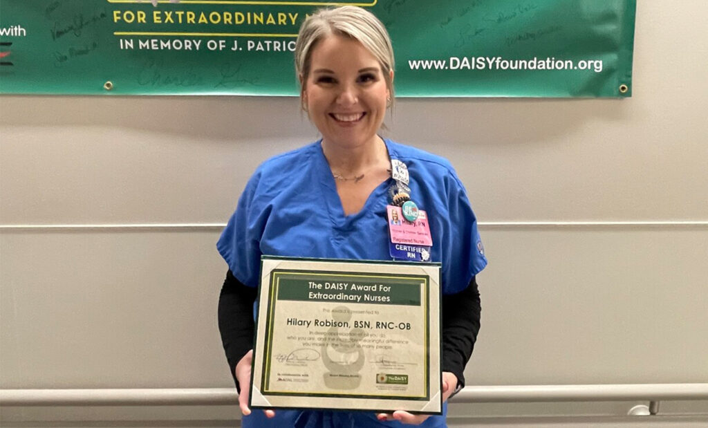 Hilary Robison poses with her DAISY award