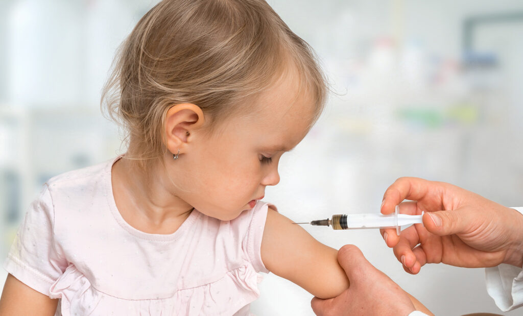 A child receives a measles vaccine shot