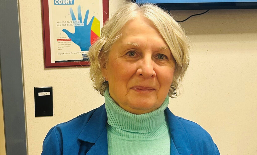 Dottie Herr wears her blue coat while volunteering