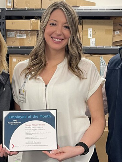 Hayley Kelley poses with her Employee of the Month certificate