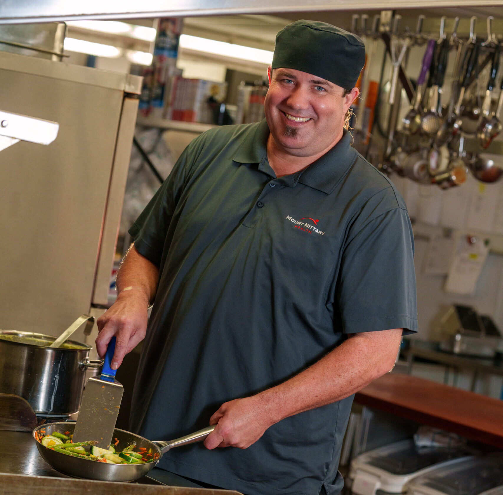 Culinary Services team member cooking in the kitchen.
