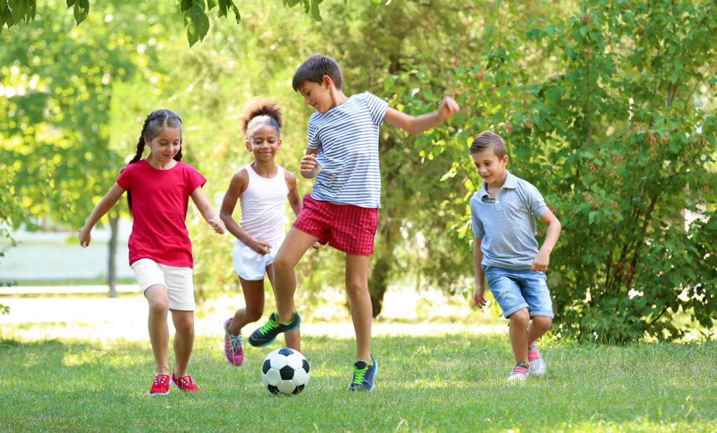 kids playing soccer outside