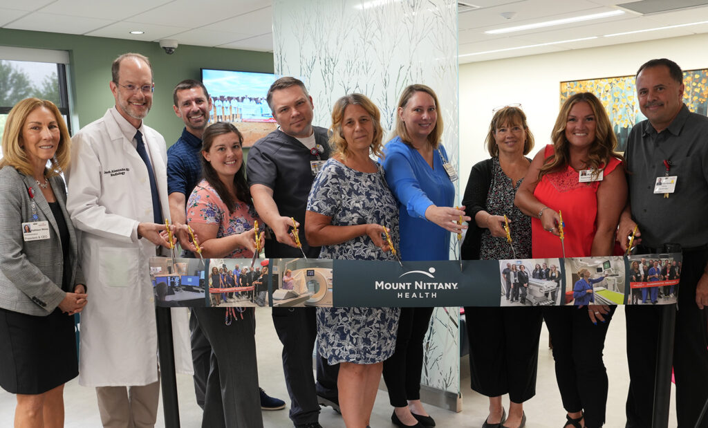 People stand in the diagnostic pavilion ready to cut the ribbon