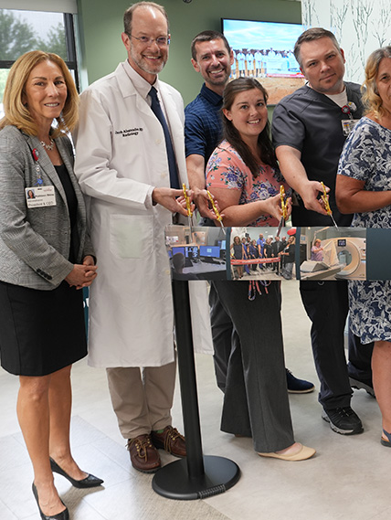 People stand in the diagnostic pavilion ready to cut the ribbon