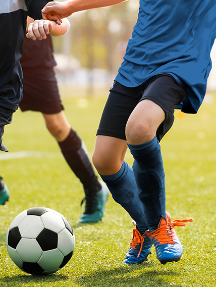 Kids playing soccer.