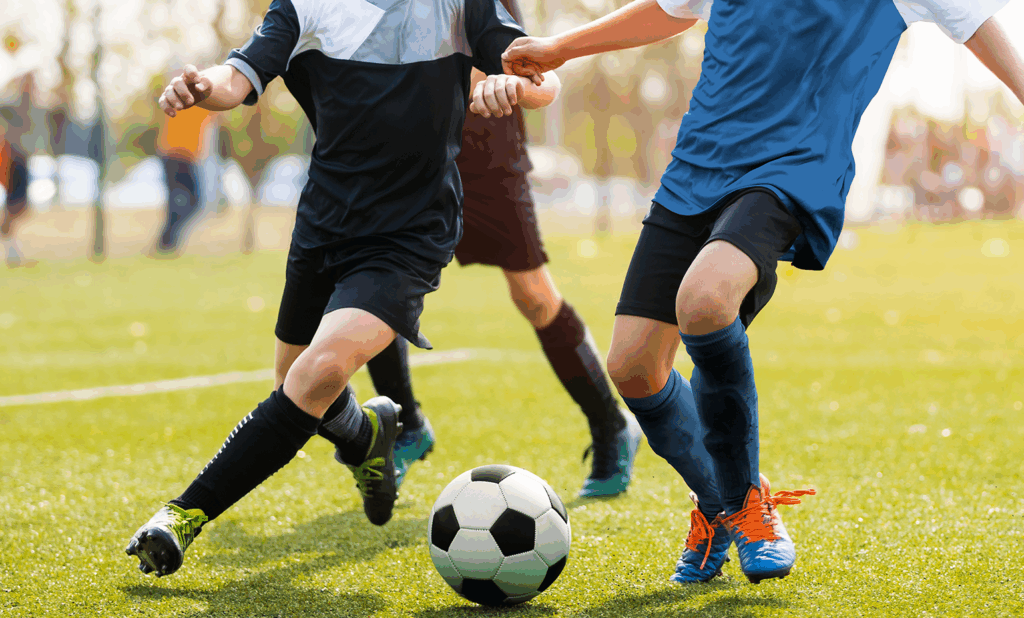 Kids playing soccer.