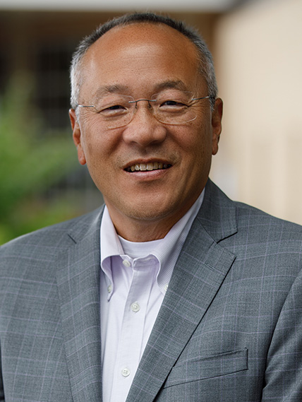 David Han, MD stands outside in a suit and the photo is a closeup