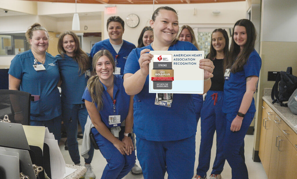 Stroke team poses with the certificate in the Emergency Department