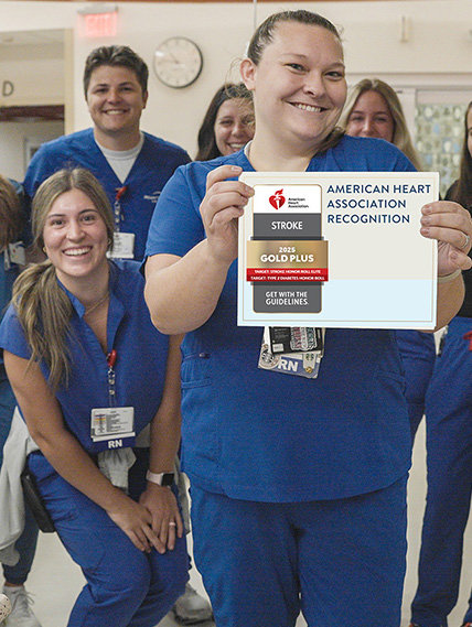 Stroke team poses with the certificate in the Emergency Department