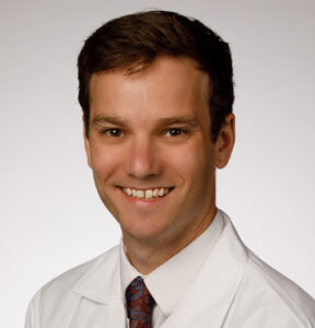 Collin Love, MD poses for a professional headshot photo