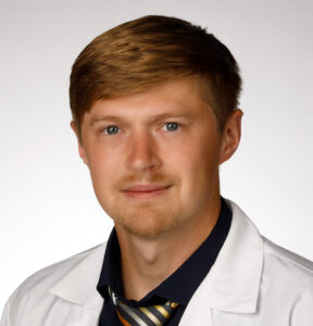 Evan Spencer, MD, poses for a headshot photo