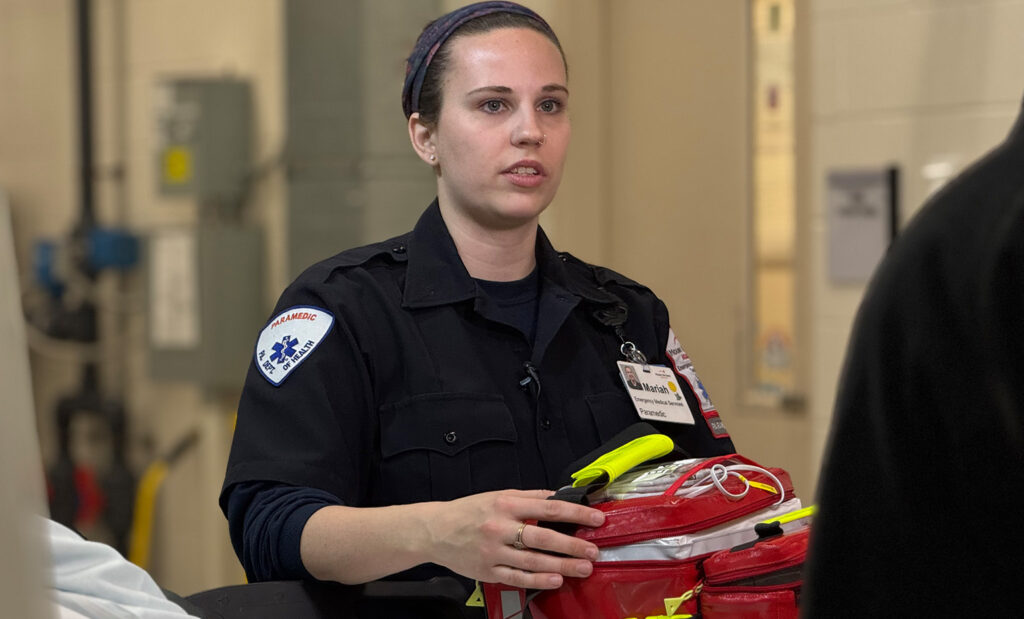 EMS member, Mariah, holds the blood donation cooler