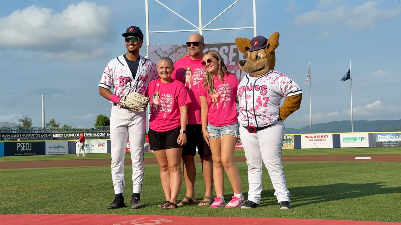 Spikes players post on the mound during Paint the Park Pink
