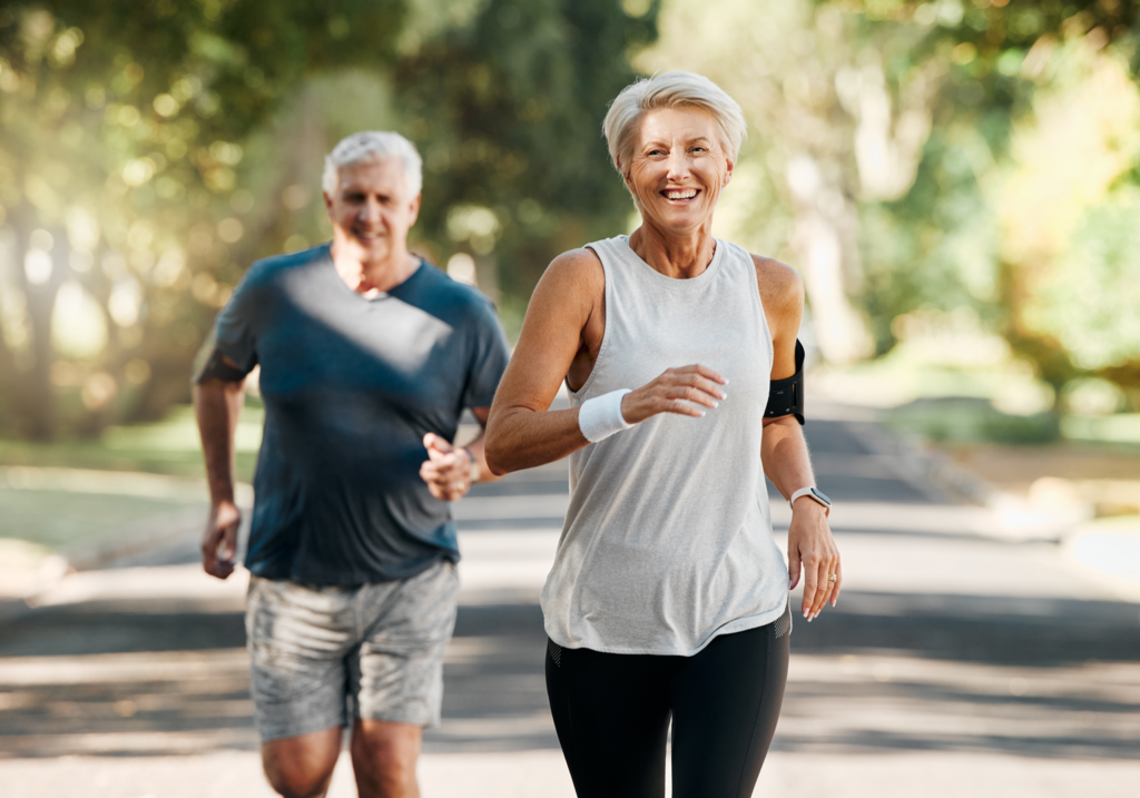 Married, mature and senior people enjoy nature run together for cardiovascular vitality