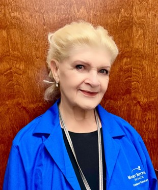 Volunteer Lucy Plaisance poses for a photo